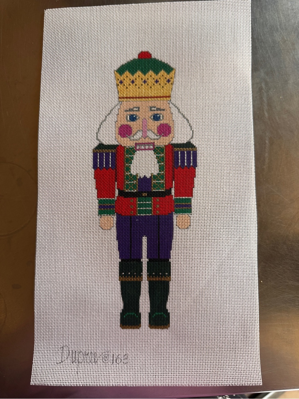 Hand-Painted Nutcracker Canvas Wall Accent in Red, Green, Purple